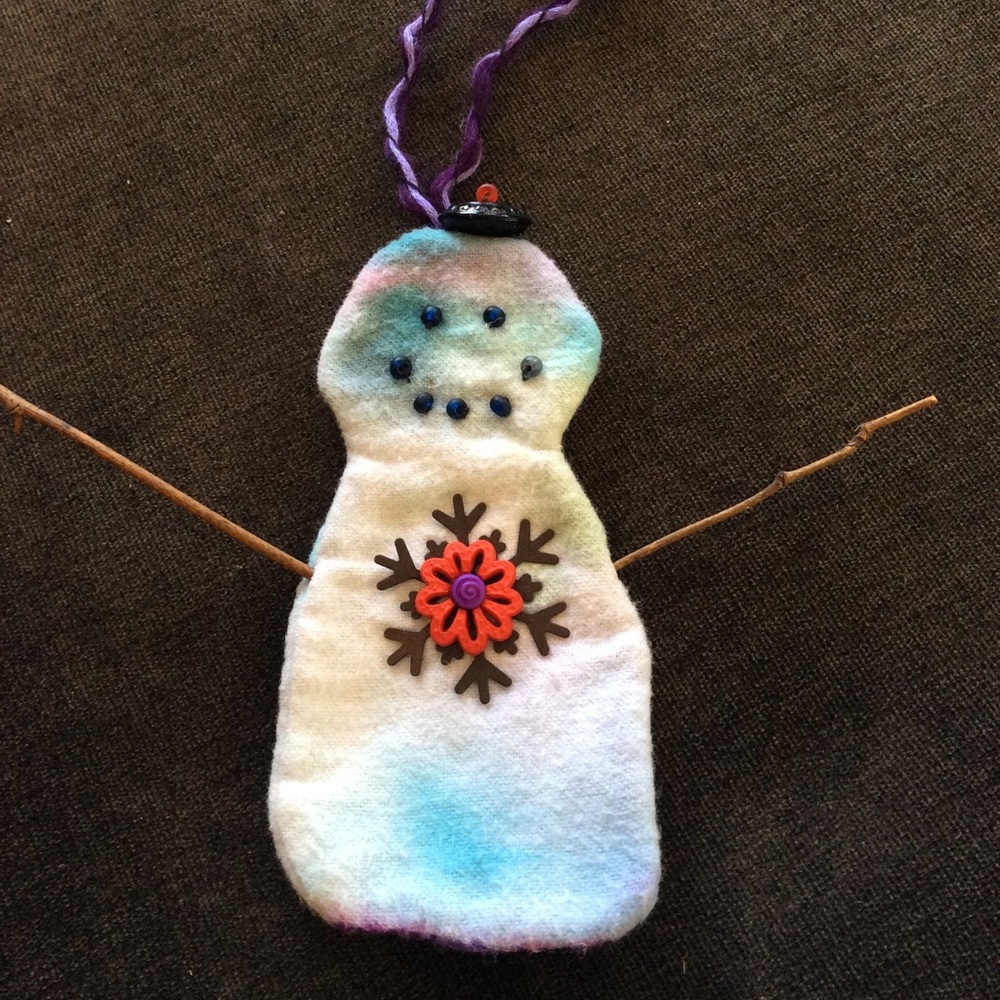 Boutique: Handmade tie dye flannel snowman ornament.